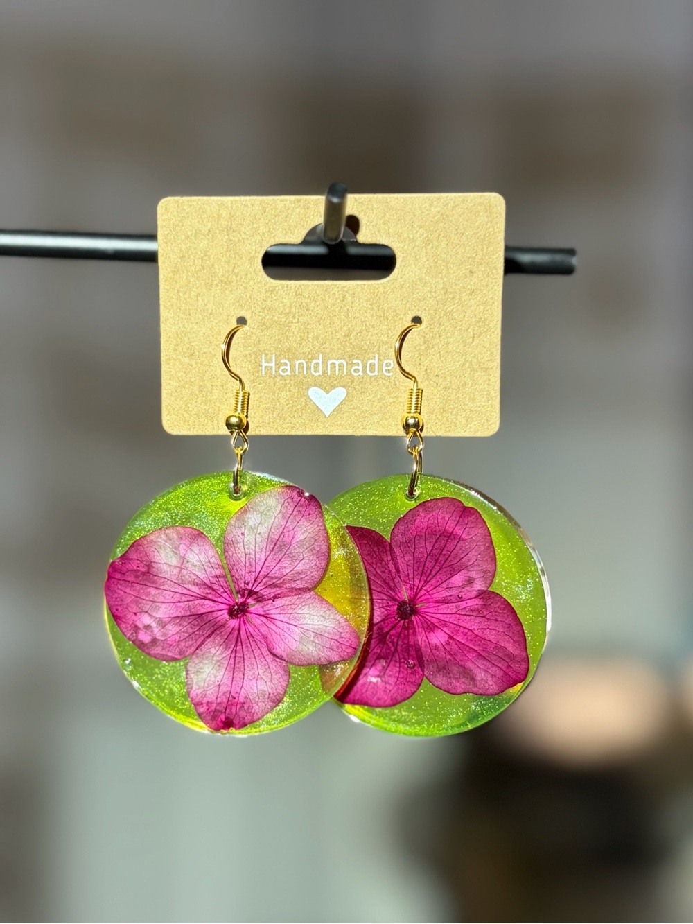 Handmade Pink Flower Resin Earrings on Lime Green